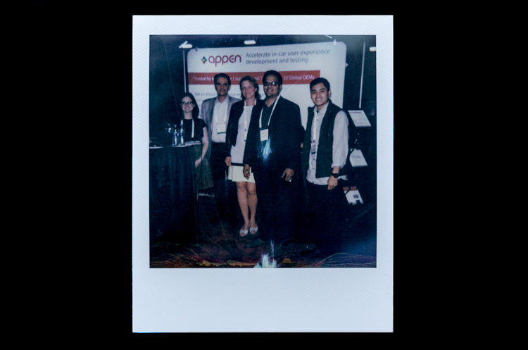 Polaroid of Appen team in Appen booth