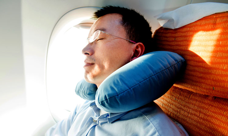 Man relaxing in an airplane seat
