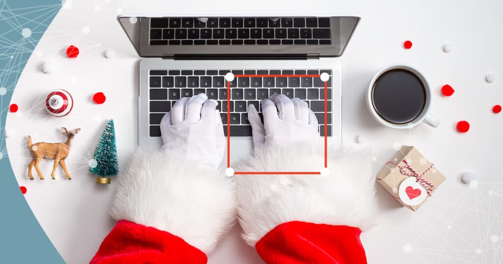 santa typing on laptop