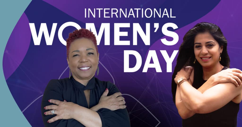 Two women holding arms cross chest, posing for embrace equity, for international women's day